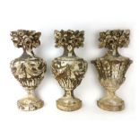 A pair of carved wood appliques each carved as a half urn with swag decoration and a profusion of