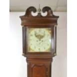 An oak and mahogany cross-banded long case clock, the painted dial with moon phase and date dial,