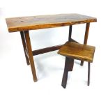 A Reynolds of Ludlow Yew wood side table, the shaped rectangular top raised on octagonal legs tied