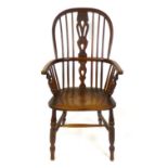 A 19th century ash and elm high back Windsor chair, pierced splat, solid seat, H stretcher.