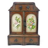 An Arts & Crafts mahogany table cabinet, a central upper drawer above a pair of arched doors