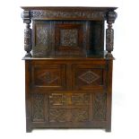 A Carolean style oak court cupboard, probably late 19th century, top section with a single