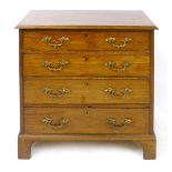 A 19th Century mahogany chest of four graduated long drawers with replacement brass swing handles,