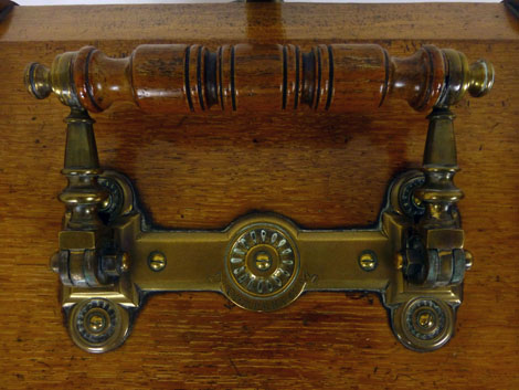 An oak purdonium, later 19th century, in the aesthetic style, folding brass mounted handle opening - Image 6 of 6