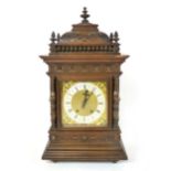 An oak cased mantle clock, circa. 1900, the 7 1/2" silvered chapter ring inscribed 'J W Benson,