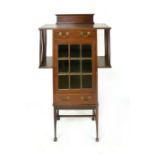 A mahogany Arts and Crafts display cabinet, circa 1900, with single drawer above a glazed cupboard