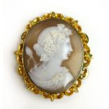 A cameo brooch carved with a classical m