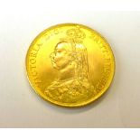 A Victorian gold coloured coin dated 188