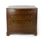 A George III mahogany bow fronted chest of drawers, early 19th century, with four graduated and cock