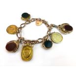 A 9 ct gold charm bracelet with various