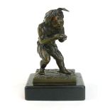 A bronze figure of a man or jester, on a