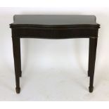 A mahogany fold out card table of serpentine form with baize lined interior, reeded frieze. w. 91cm.