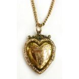A 9 ct gold heart shaped pendant on a go
