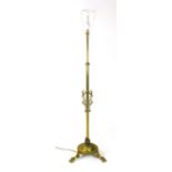 A brass telescopic lamp standard, early 20th century, with Art Nouveau style swirling decoration