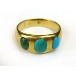 A yellow metal and turquoise mounted ring, total overall weight 39 gms approximately. CONDITION