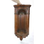 A late Victorian mahogany and line inlaid corner niche, dated 1898, moulded cornice above a shell