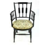 A William Morris style ebonised Arts & Crafts chair with spindle supports, turned legs and