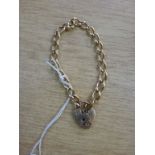 A 9 ct gold bracelet with a heart shaped