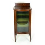 An Edwardian mahogany and satinwood line inlaid display cabinet with bowed glazed door. h. 113cm.