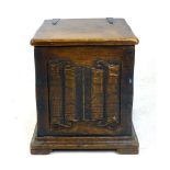 An oak coal scuttle, hinged top above a linen fold carved front, h. 40cm, w. 37cm. CONDITION REPORT: