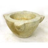 A white marble mortar. d. 45 cm h. 22 cm. CONDITION REPORT: Slight chips to edges and lobes.