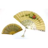 Two Victorian fans, the first with mother of pearl stick and florally painted silk panel, the second