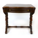 A mahogany sofa table, 19th century, of serpentine form with a single frieze drawer, on carved and