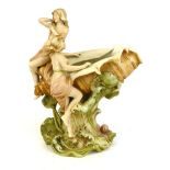 A Royal Dux Art Nouveau style centre piece, model 1066, modeled as two maidens seated on a large
