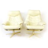 A pair of 1970's cream leather and tubular armchairs on five-star bases by Skoghaug of Norway
