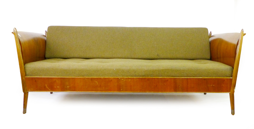 A 1950/60's walnut framed sleigh-type daybed with a detachable storage drawer, l. 213 cm CONDITION