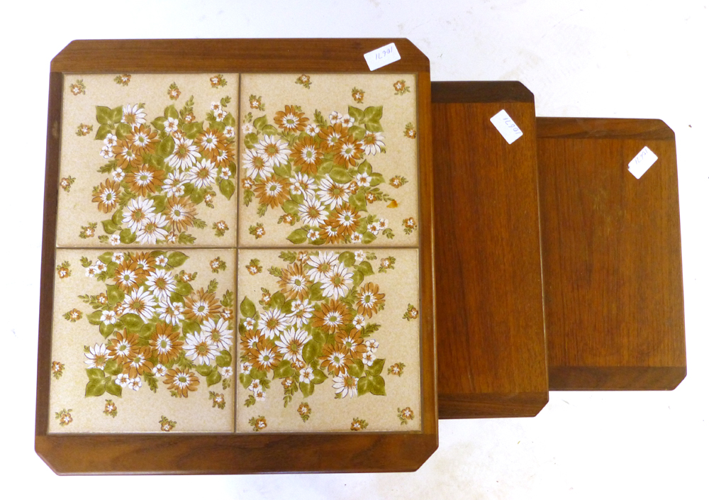 A nest of three G-Plan tile topped and teak coffee tables, max. w. 49.5 cm CONDITION REPORT: - Image 2 of 2