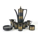 Susan William-Ellis for Portmerion, a six sitting coffee set, the black ground decorated with gilt