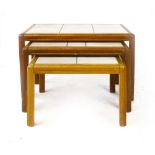 A nest of three Danish tile topped and teak framed coffee tables, max. w. 66 cm CONDITION REPORT: