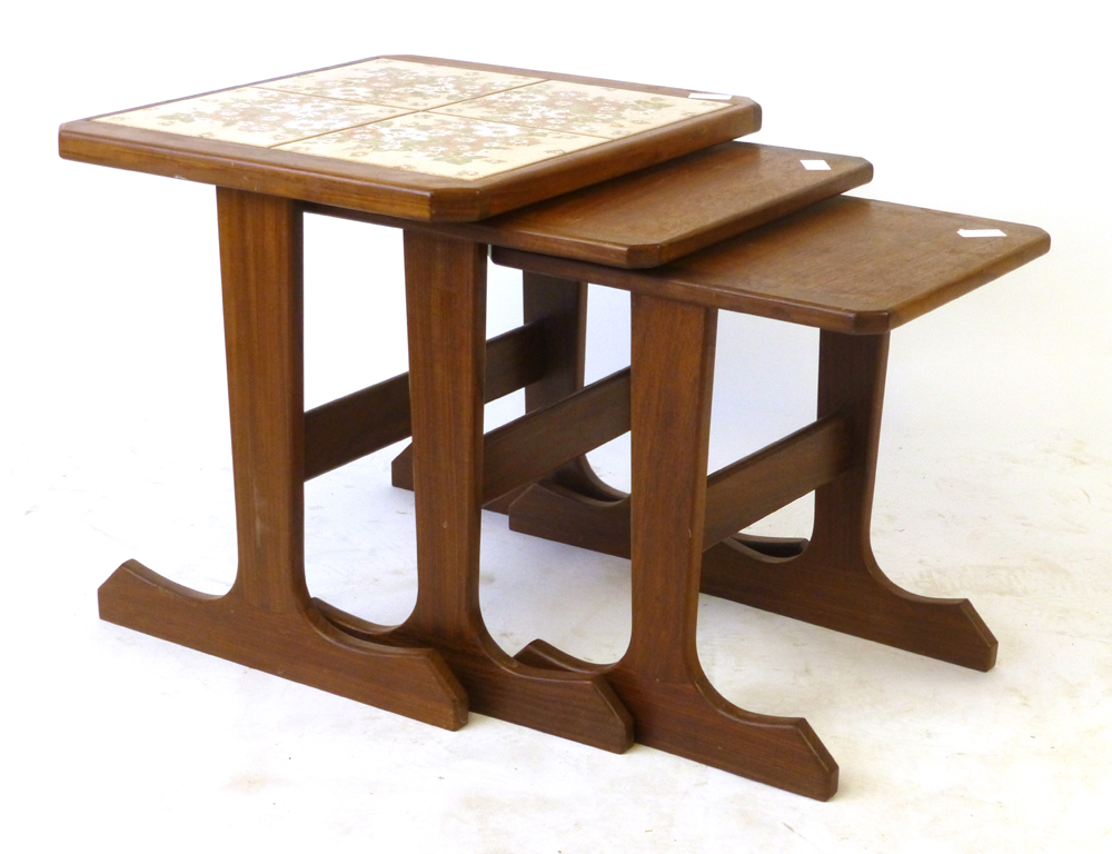 A nest of three G-Plan tile topped and teak coffee tables, max. w. 49.5 cm CONDITION REPORT: