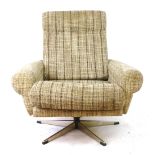 A 1960/70's highback lounge armchair with brown fabric upholstery on a chrome four-star swivel