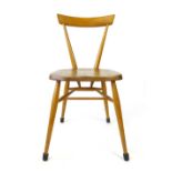 An Ercol elm and beech stacking chair with single back rest on tapering legs CONDITION REPORT: