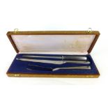 Tias Eckhoff for Maya of Norway, a cased stainless steel carving set CONDITION REPORT: Wear