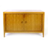 David Booth for Gordon Russell Ltd, a walnut and crossbanded 'Helix' sideboard, the two doors