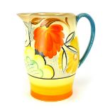 An Art Deco jug, the white ground decorated with orange, yellow and green stylised flowers, by Grays