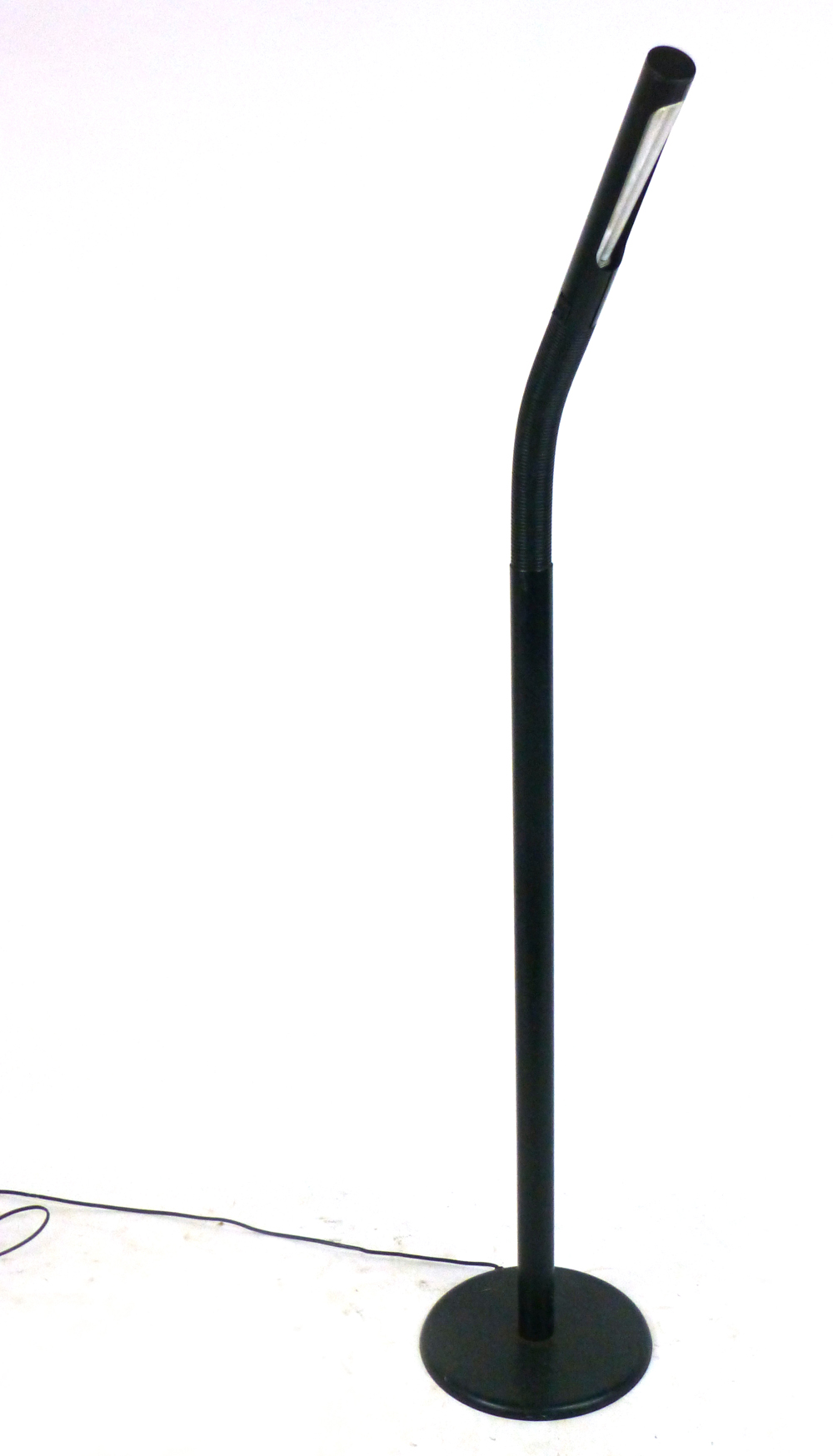 A 1980's single spot standard lamp in black with an adjustable shade  CONDITION REPORT: Dents,