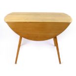 An Ercol elm drop-leaf dining table on beech square tapering legs, d. 104 cm CONDITION REPORT: