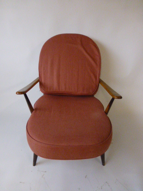 An Ercol stained beech armchair with loo