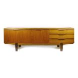 A 1960's teak sideboard with an arrangement of two doors and two drawers, on afromesian legs,