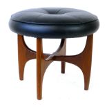 A G-Plan teak and black vinyl stool of typical form CONDITION REPORT: Wear commensurate with age,