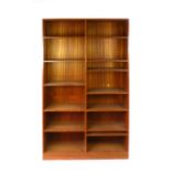 A teak open fronted adjustable bookcase on a plinth base, w. 110.5 cm CONDITION REPORT: Holes for
