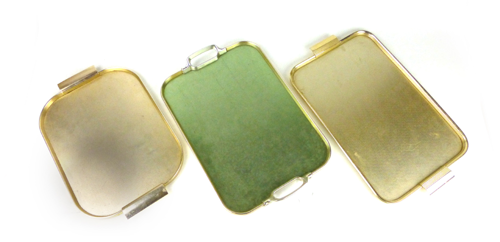 A pair of 1970's anodised serving trays together with another similar CONDITION REPORT: Fair