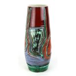 A Poole Delphis vase of tapering cylindrical form typically decorated with red, blue and green