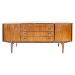 A 1950/60's Beautility sideboard, the top opening to reveal a fitted canteen, over three drawers