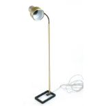 A 1970's single spot standard lamp on a brass coloured shaft CONDITION REPORT: Dents, knocks,