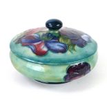A Moorcroft powder box and cover in the Anemone pattern with impressed marks, 12cm diameter